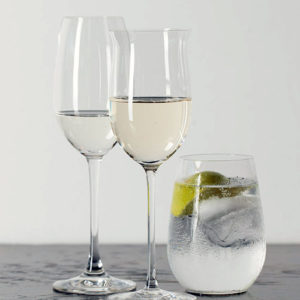 two wine glasses with gin and tonic